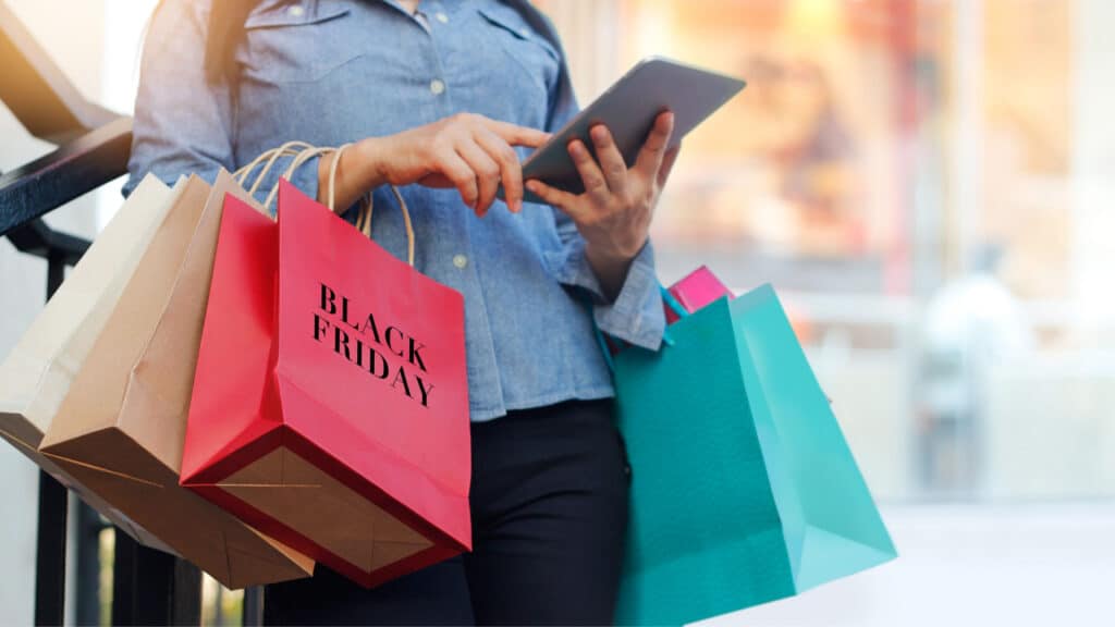 a woman checking her phone while shopping