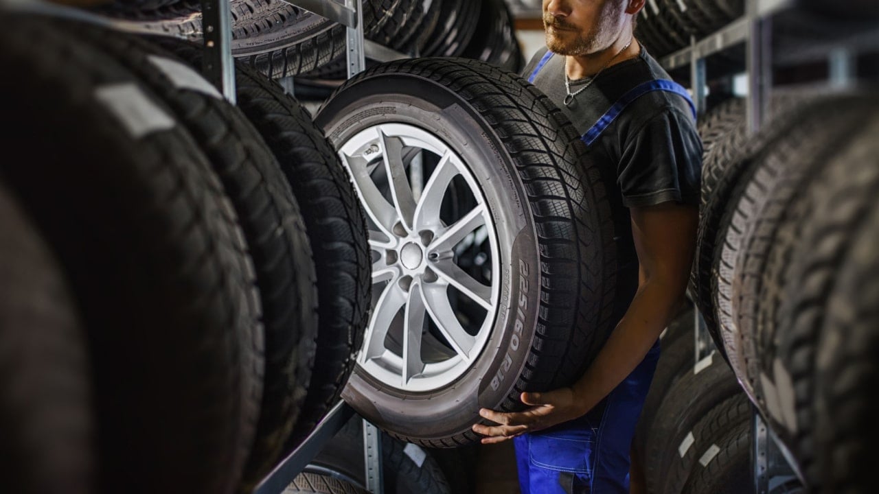 a man working at a tire shop