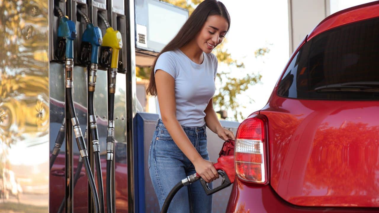 Woman fueling car