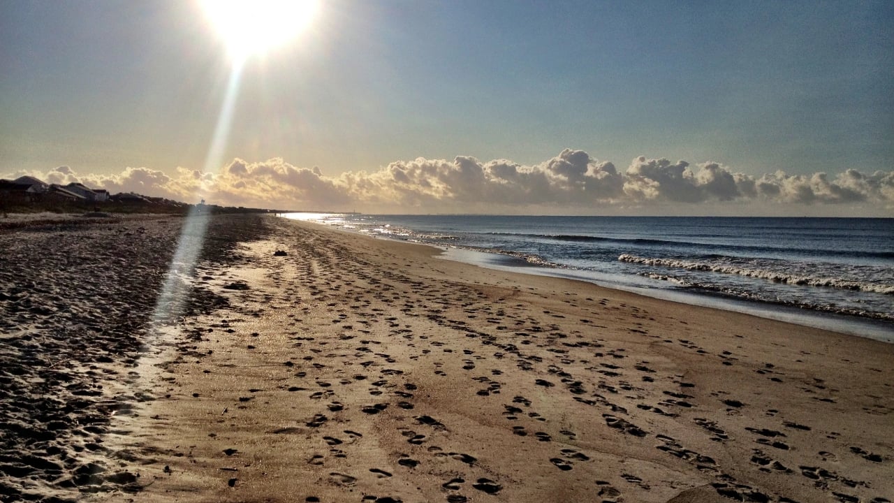 Looking east down the beach of Oak Island, North Carolina