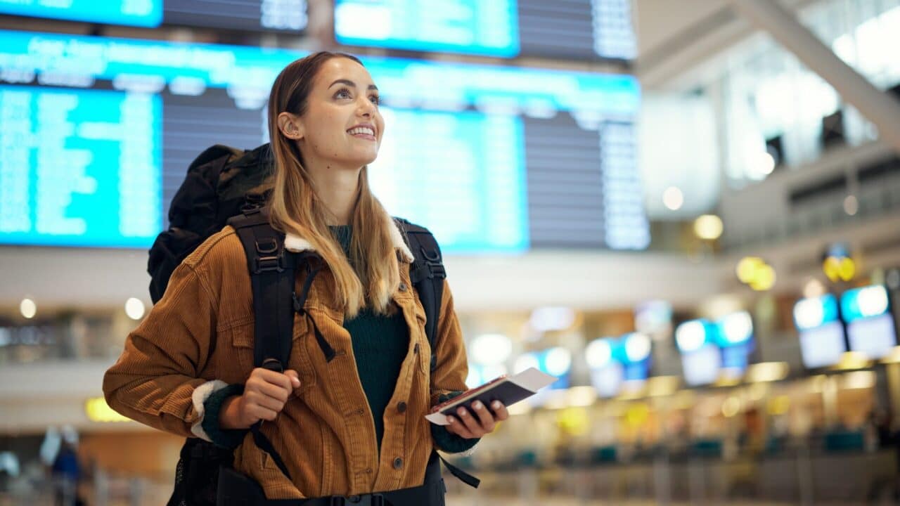 Woman at airport with backpack, travel, traveling, vacation, flight, plane
