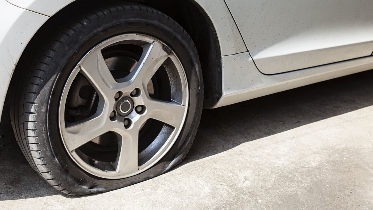 car wheel flat tire on the road