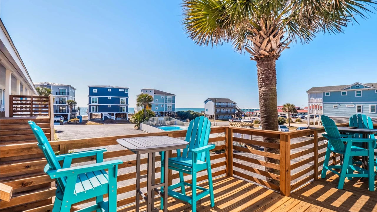 Sunny and relaxing deck at the Beach House Motel and Suites in Oak Island, NC