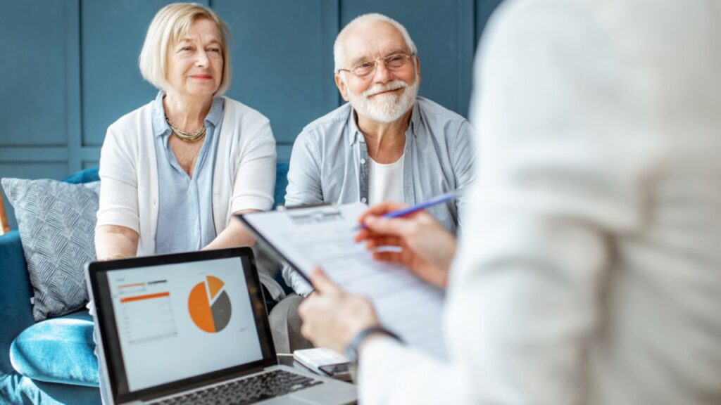 senior couple talking about retirement investing