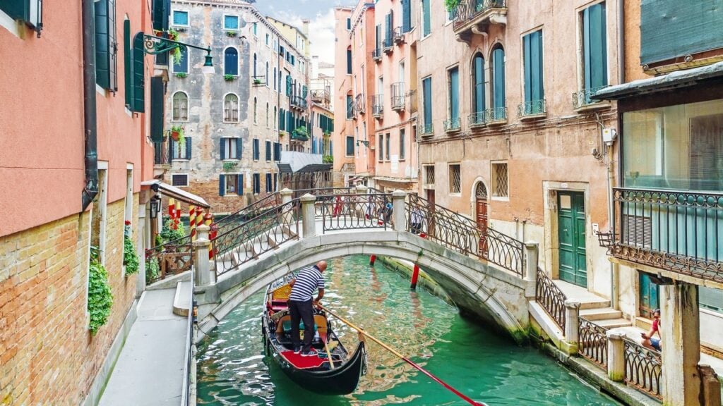 A boat ride through the canals of Venice, Italy on a sunny day.