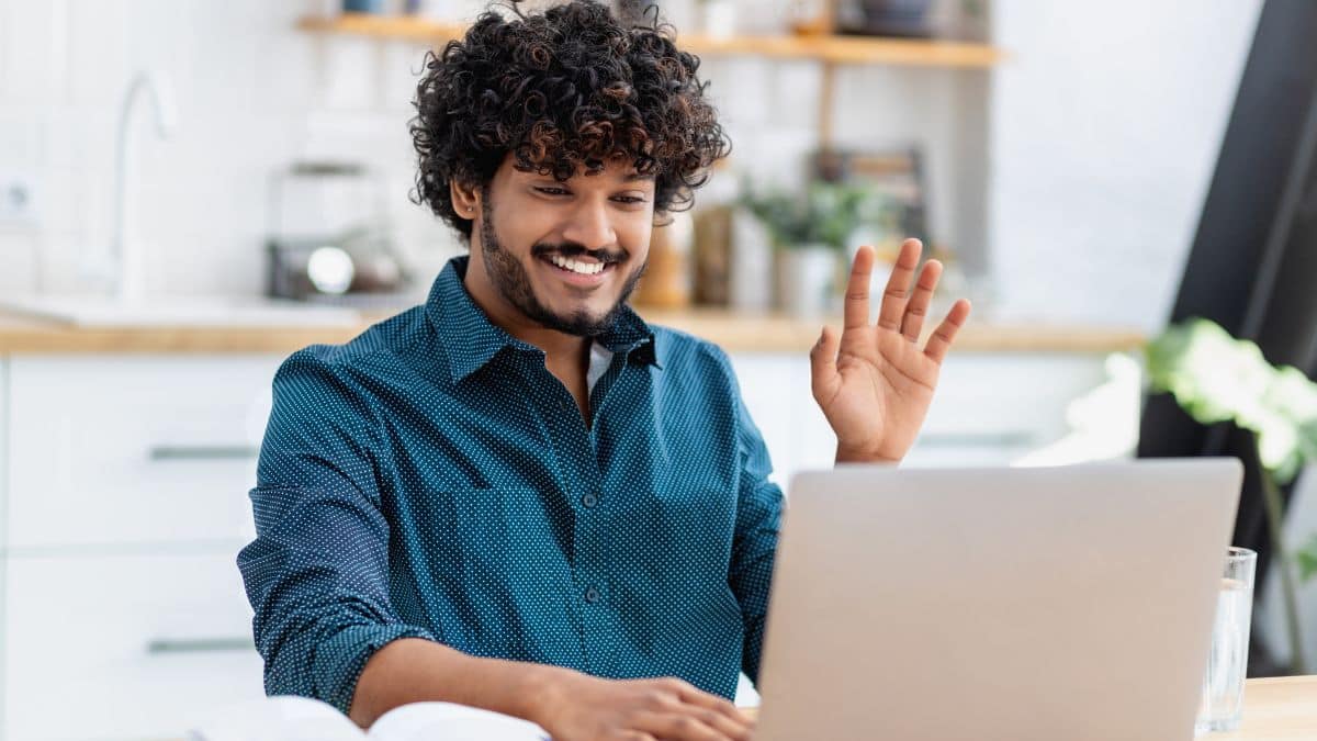 Man doing a video survey on his laptop