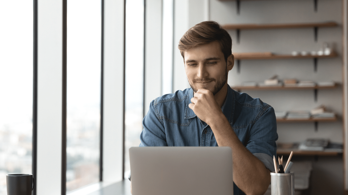 Man sitting at his computer taking online surveys